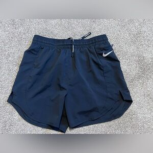 Nike running shorts. Size XS. Black, zipper pocket. Excellent preowned condition